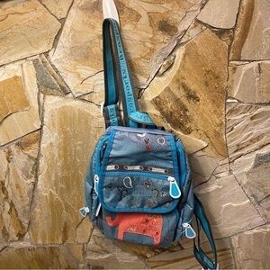Brosports backpack in a shade of teal with elephants and birds - fun to wear